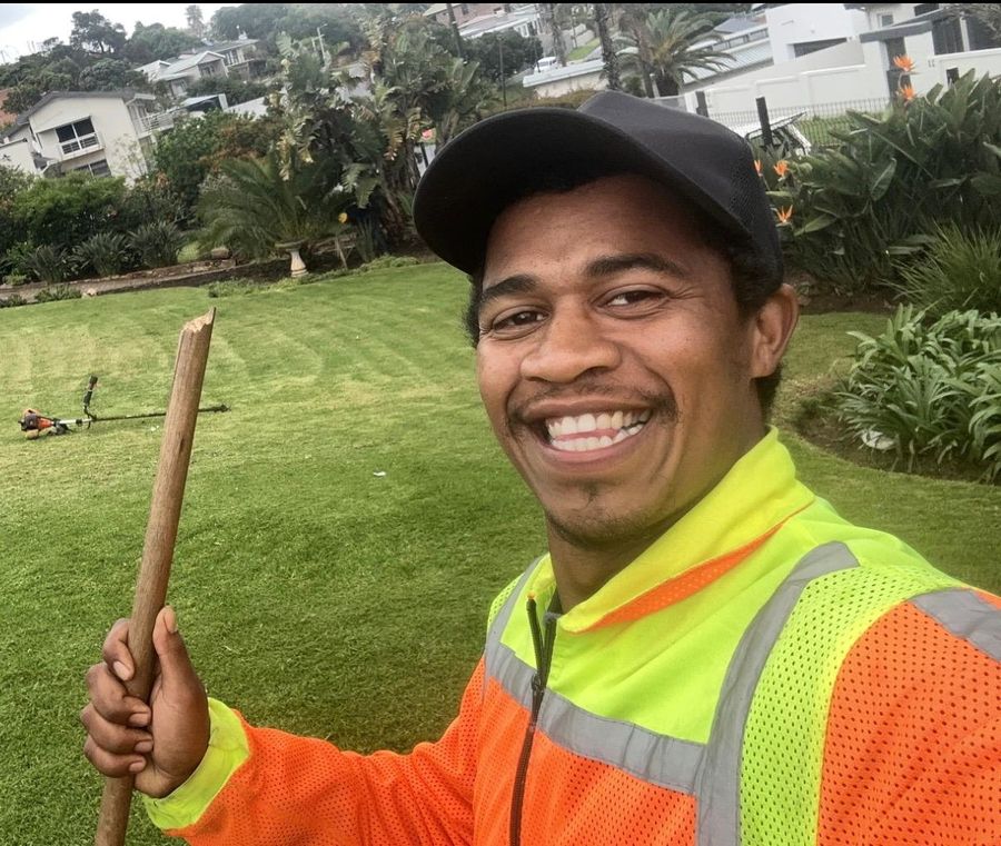 Nathan Matthews, owner of NJ Services, on a freshly mown lawn