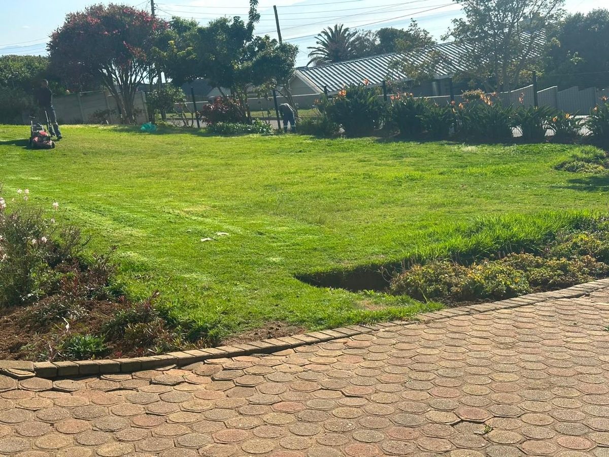 Freshly mowed lawn with beds edged and cleaned